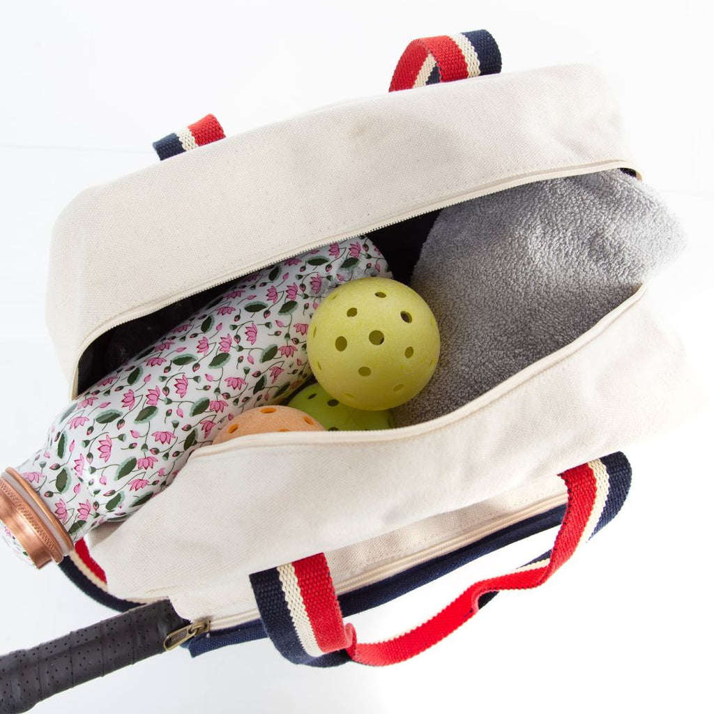 Embroidered Personalized Pickleball Bag Natural color with Red and Royal Blue Handles in practical use